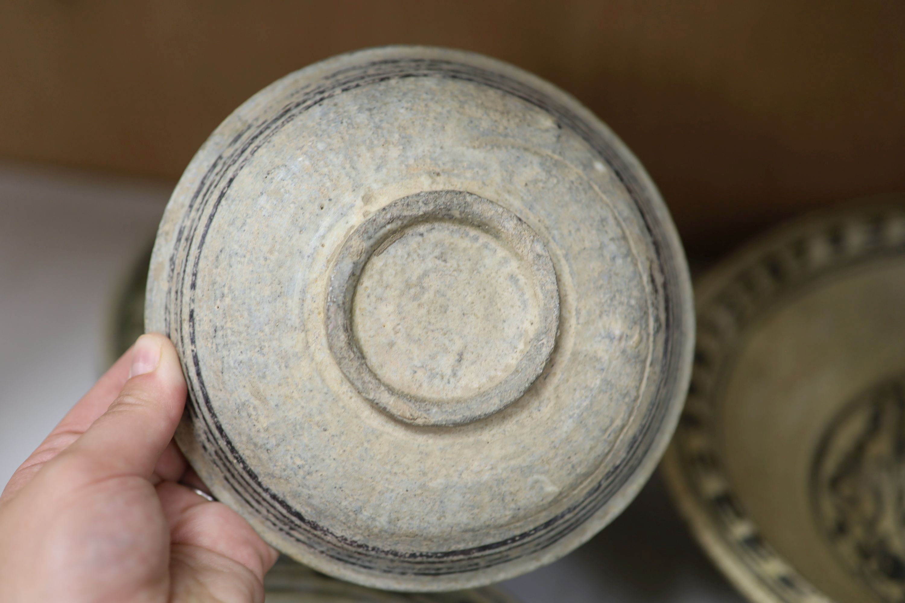 A group of Sukhothai style pottery dishes, largest diameter 29cm (7)